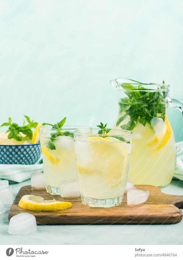 Fresh lemon lemonade in jug and glasses summer infused drink cocktail fruit leaf frozen italian spring juice citrus beverage food vintage mint gin vodka