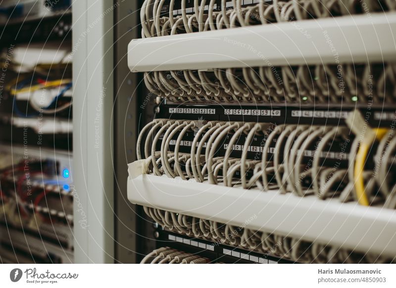 server room rack with cables close up business center closeup computer connection data database digital drive electronic equipment ethernet hardware industry