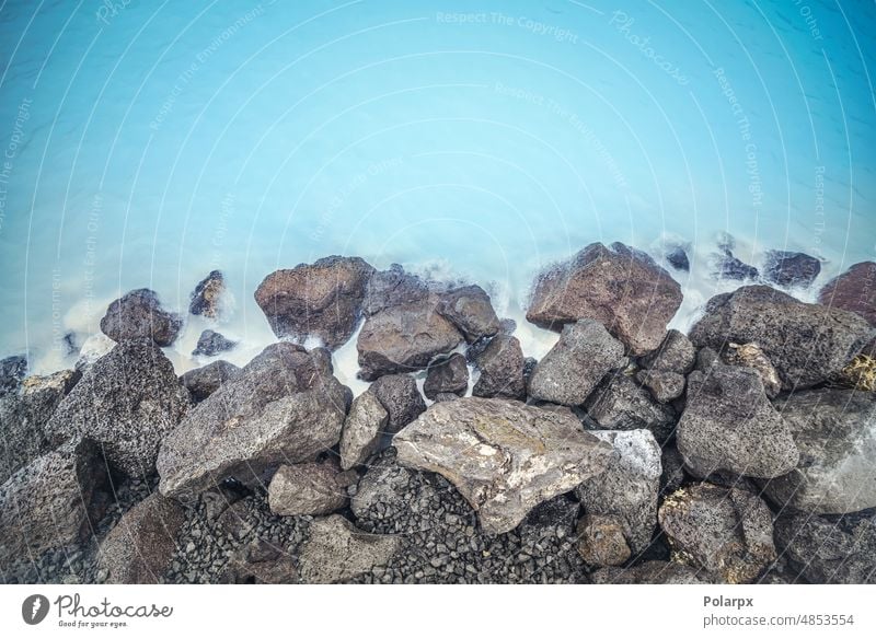 Lava rocks by the Blue Lagoon in Iceland steamy pebble geothermic colorful wilderness wellness urban heal nobody foam evening relax beautiful geology