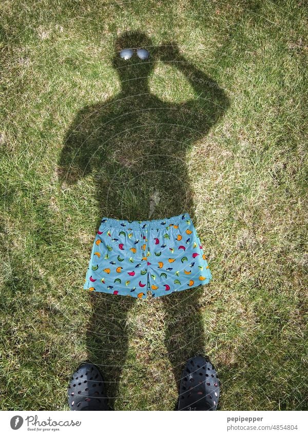 henpecked husband Shadow Shadow play Dark side Shadowy existence shadow cast shade dispenser Shadow child Swimming trunks Swimwear bathe Exterior shot