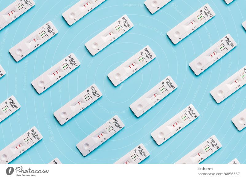 Top view of a creative pattern of rapid antigen test kits with different positive and negative results for COVID-19. covid-19 Virus coronavirus