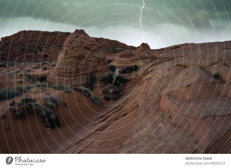 Scenic view of canyon under thunderstorm sky vermillion cliffs landscape travel arizona desert twilight usa outdoors nature monument arid colorful wilderness