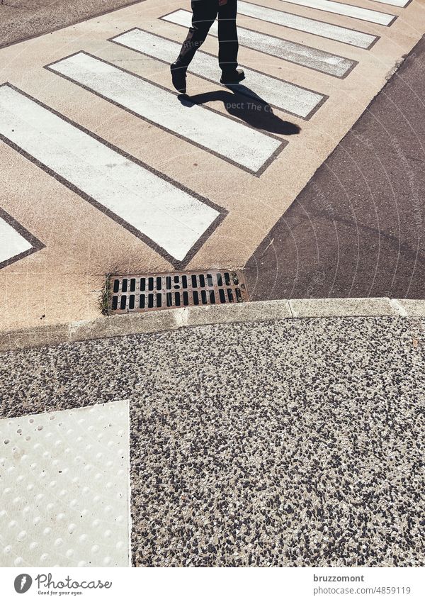 Pedestrian crosses crosswalk in France Zebra crossing Shadow Transport Street Traffic infrastructure Exterior shot Lanes & trails Pedestrian crossing Town