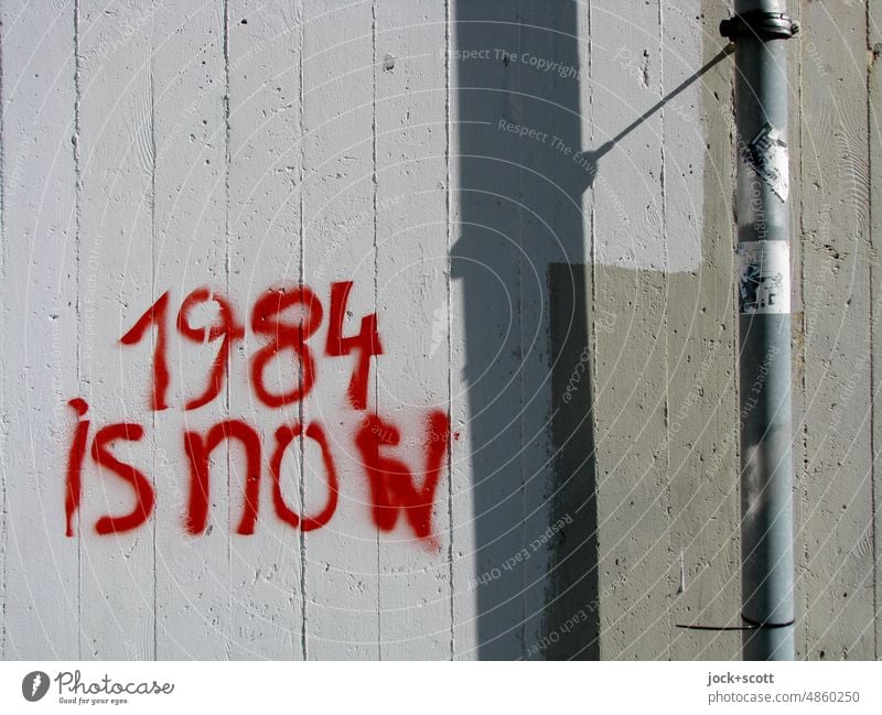 1984 is now, is no longer fiction Stencil letters Street art Creativity Wall (building) Word Typography Police state Concrete wall Future Might Threat English