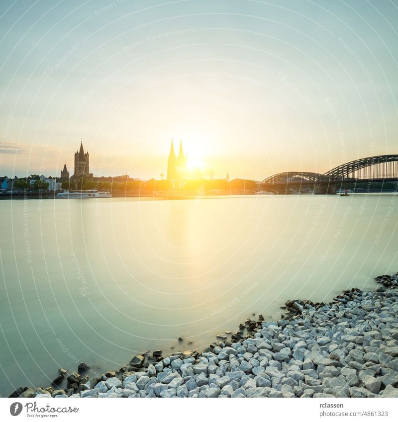 Cologne city with cathedral at sunset Cologne Cathedral Rhine Hohenzollern Germany river Carnival Kölsch church bridge dusk gothic tourism landmarks