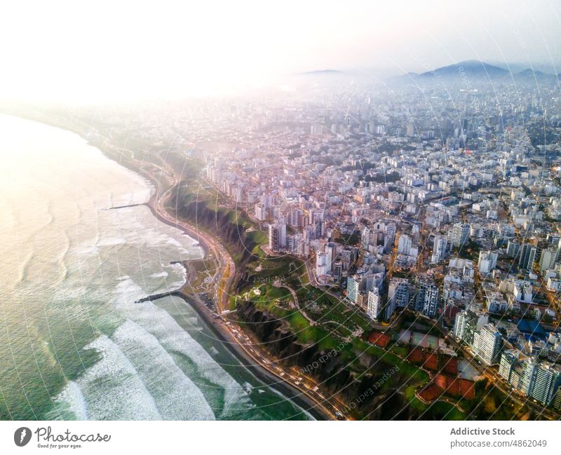 Scenic cityscape with contemporary multistory buildings and wavy ocean architecture nature district picturesque sea coastline beach house modern breathtaking