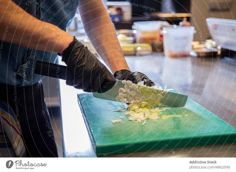 Chef Chopping Vegetable With Knife On Cutting Board Commercial Kitchen Leek Cooking Preparing Food Restaurant Meal Hand Industrial Fresh Midsection Occupation