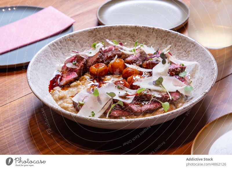 Steak Garnished With Cheese And Herb On Kitchen Counter Restaurant Closeup Main Dish Commercial Beef Bowl Gourmet Barbecue Delicious Dinner Juicy Served Cuisine