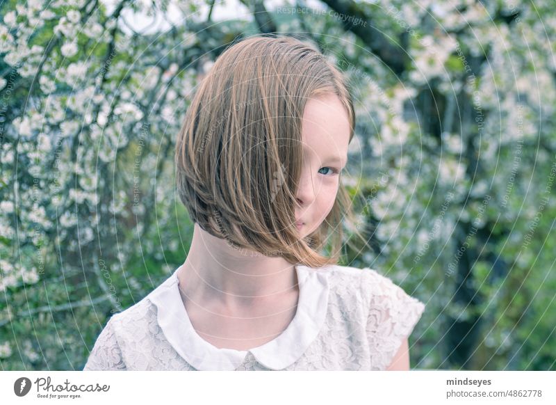 Young Girl with Cherry Blossoms hair in the wind Hair and hairstyles Exterior shot Summer Cherry blossom Cherry tree shy shyness Nature Spring Tree Fragrance