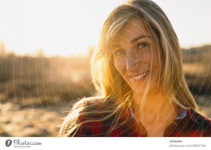 smiling woman outdoors portrait. Soft sunlgiht in the background.Close portrait. smile happy autumn female natural adult beautiful beauty brunette caucasian