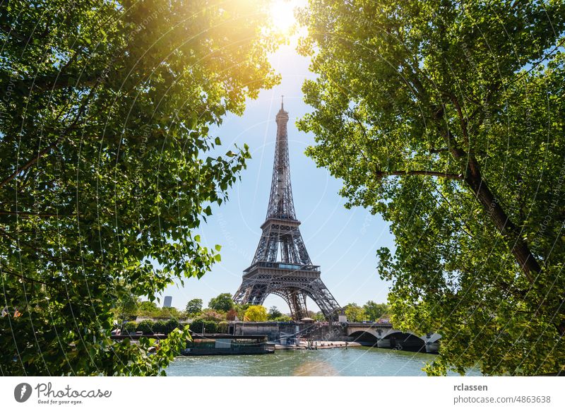 Paris Eiffel Tower and river Seine at sunset in Paris, France. Eiffel Tower is one of the most iconic landmarks of Paris. Postcard of Paris eiffel tower france