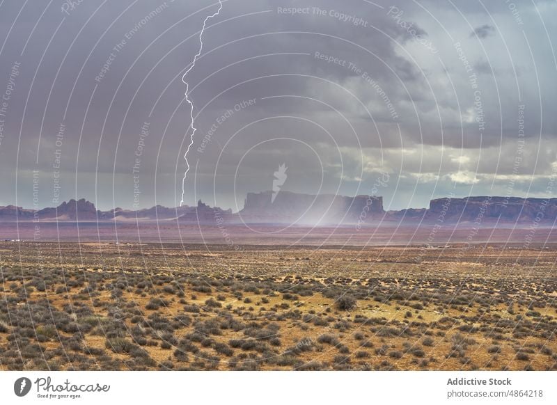 Scenic from above view of mountain under thunderstorm sky cliffs utah Arizona national park landscape Monument Valley cloudy travel butte rocky outcrop