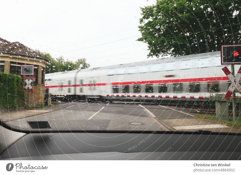 The train has the right of way / wait at the closed railroad barrier Train moving train Railroad Train travel Public transit Passenger train