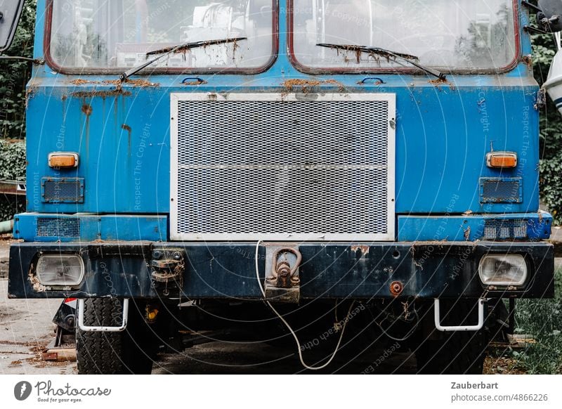 Radiator of an old truck in blue Truck cooler Blue Old rusty Transport logistics lorries lorry Vehicle Driving Cargo Sharp-edged Frontal Windscreen