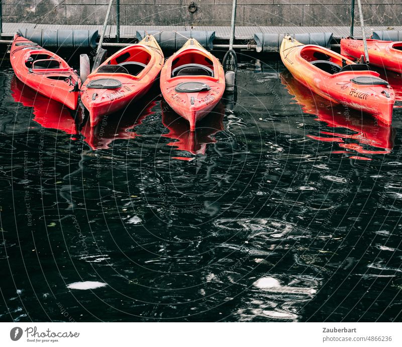 Red kayaks on dark water Kayak Water Waves Dark mirror Lake Reflection Surface of water Water reflection Harbour Sport boats Aquatics Paddling canoe