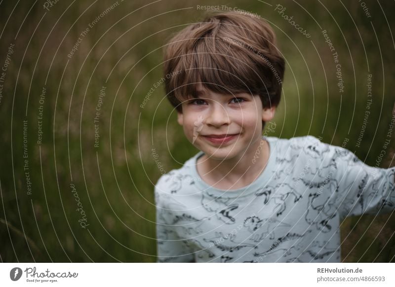 Boy grins into the camera Child Human being Boy (child) Infancy Smiling naturally Contentment Looking into the camera portrait Upper body Forward