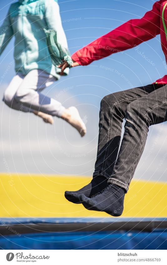 Children on trampoline in field Trampoline Field Jump Hop Joy Movement Exterior shot Playing Girl Athletic Infancy Summer Happiness Happy fun