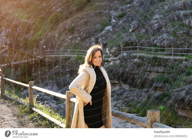 Young woman on a mountain route hiking walk posing young nature caucasian copy space portrait contemplating river wood galicia forest sustainability parkland