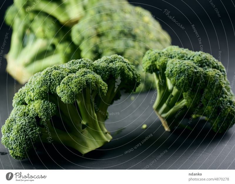 Fresh green head of broccoli on black background vegetable food healthy raw organic fresh diet vegetarian ingredient nourishment ripe vitamin salad cabbage