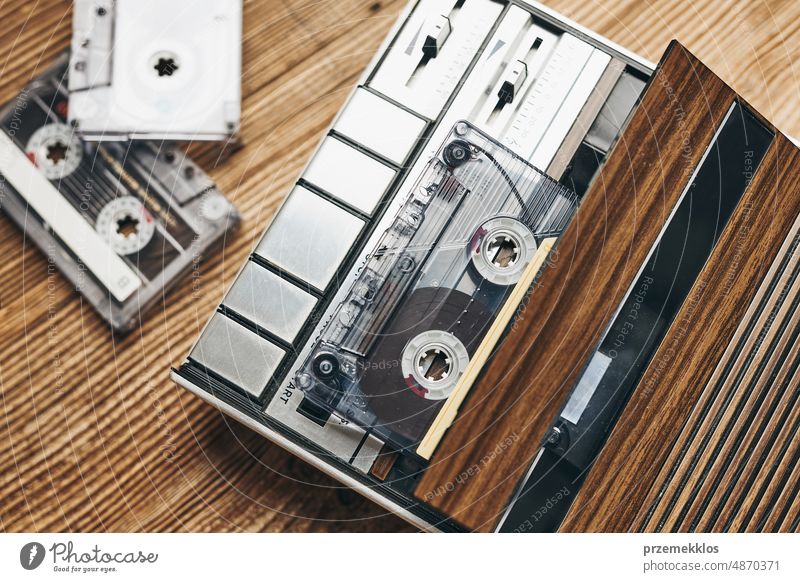 Compact cassette tapes and cassette recorder. Retro music style. 80s music party. Vintage style. Analog equipment. Stereo sound. Back to the past compact player