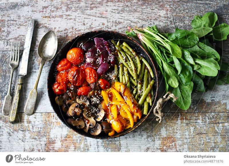 Baked vegetables in a pan. Healthy bright food. Cooking at home. Vegan diet. vegetarian vitamin dietary mushroom paprika vegan antioxidant bell pepper green