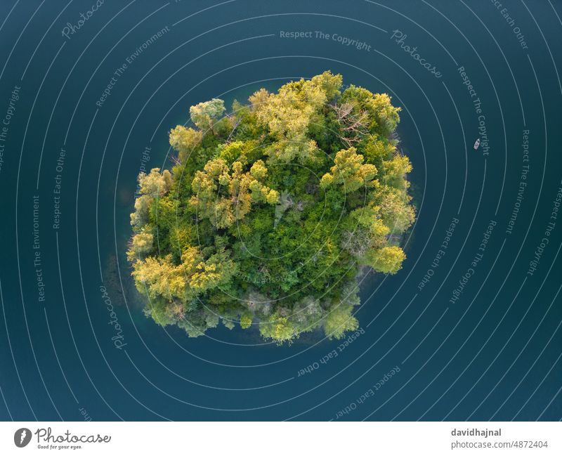 Aerial view of a small island and a small boat in the Binsfeldsee near Speyer. Pond Lake Quarry binsfeldsee Germany Rhine River Sunset Dusk ship Small Little