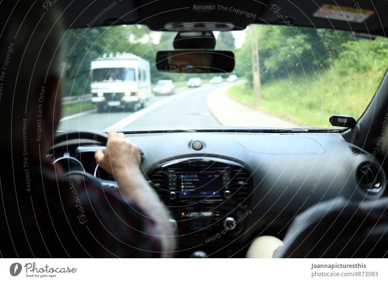 Motorist on country road in forest road trip Camper bulli Car Vacation & Travel Street Freedom Trip Environment Tourism Wanderlust Adventure Road traffic