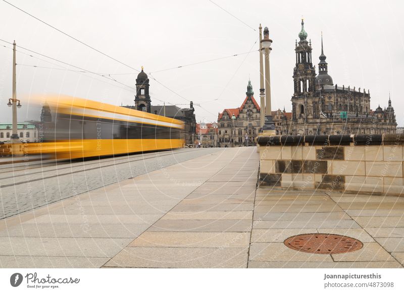 Streetcar in front of old town panorama with motion blur Tram Transport Town Means of transport Traffic infrastructure Passenger traffic Public transit