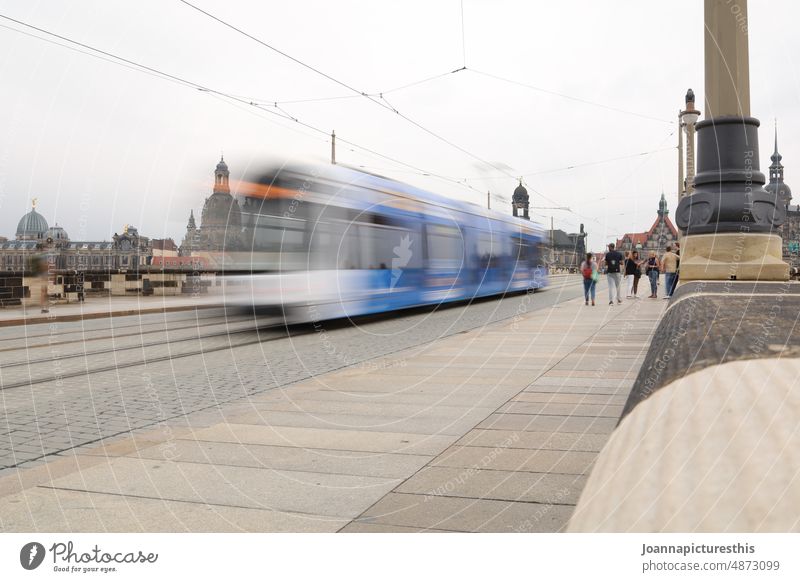 Streetcar in motion blur on street in old town Tram Transport Means of transport Public transit Urban transport Rail transport Passenger traffic Rail vehicle