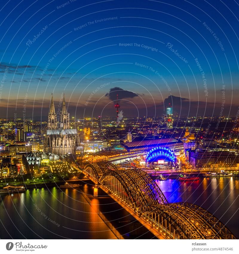 Cologne Cathedral and bridge at sunset cologne city cologne cathedral old town Rhine Hohenzollern Germany dom river carnival kölsch church europe dusk evening