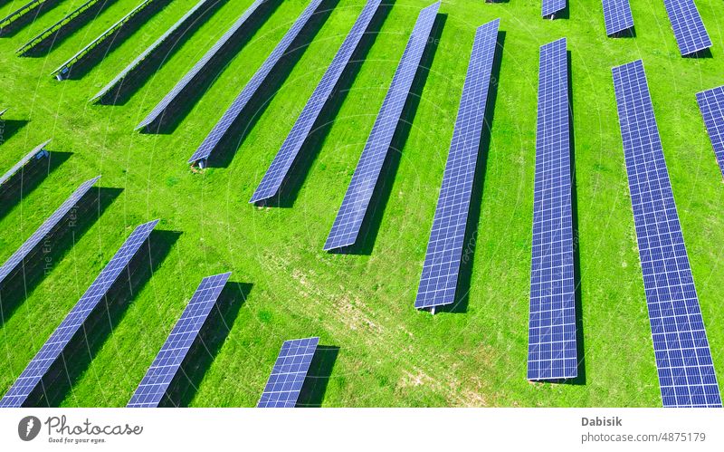 Solar panels in green field, aerial view solar energy photovoltaic renewable sustainable battery power technology clean solar panel solar battery clean energy