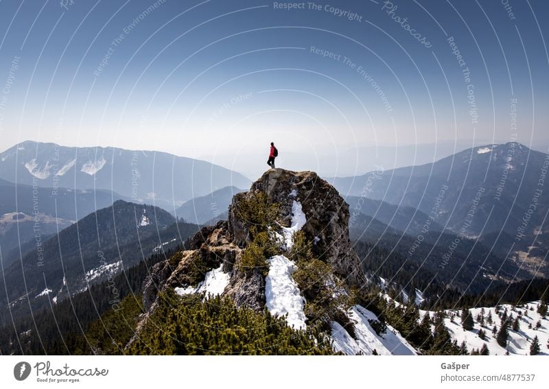 Female hiker on a mountain peak gazing into the valley below. hiking female travel trekking journey freedom lifestyle nature adventure active traveler outdoors