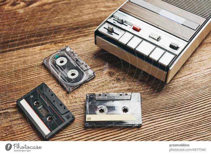 Compact cassette tapes and cassette recorder. Retro music style. 80s music party. Vintage style. Analog equipment. Stereo sound. Back to the past compact player