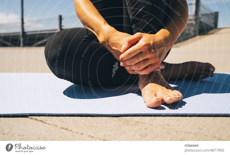 young woman sit on blue yoga or fitness mat after working out. keep fit concepts image pilates power sitting european people legged beautiful exercise happy