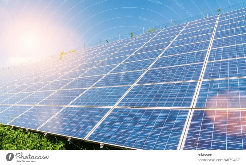 Solar Panels Against The Deep Blue Sky solar panel energy sun cell photovoltaic green system home industry generator sunlight technology power field sky