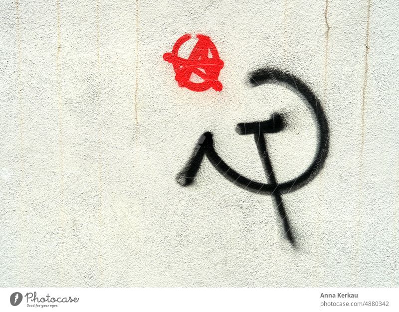 Hammer and sickle graffiti on white wall Graffiti hammer and sickle street art Wall (building) Facade Art Subculture Trashy Street art Daub Characters