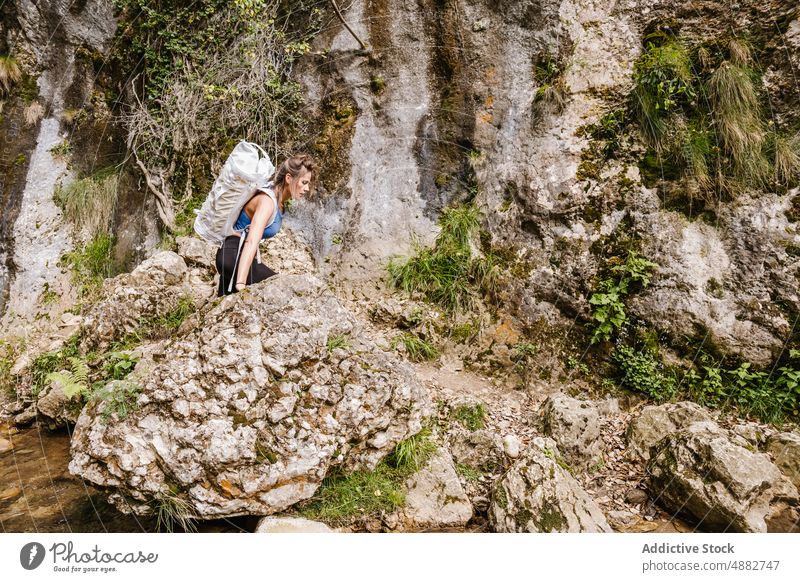 Woman With Backpack walking On Rock By Stream In Forest Standing Hiker Hiking Adventure Exploration Activity Vacation Backpacker Nature Travel Trekking