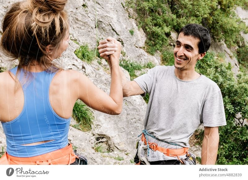 Happy Couple Holding Hand On Cliff Smiling Hiker Teamwork Happiness Climber Hiking Cheerful Rappel Prepare Standing Mountaineering Sport Adventure Activity