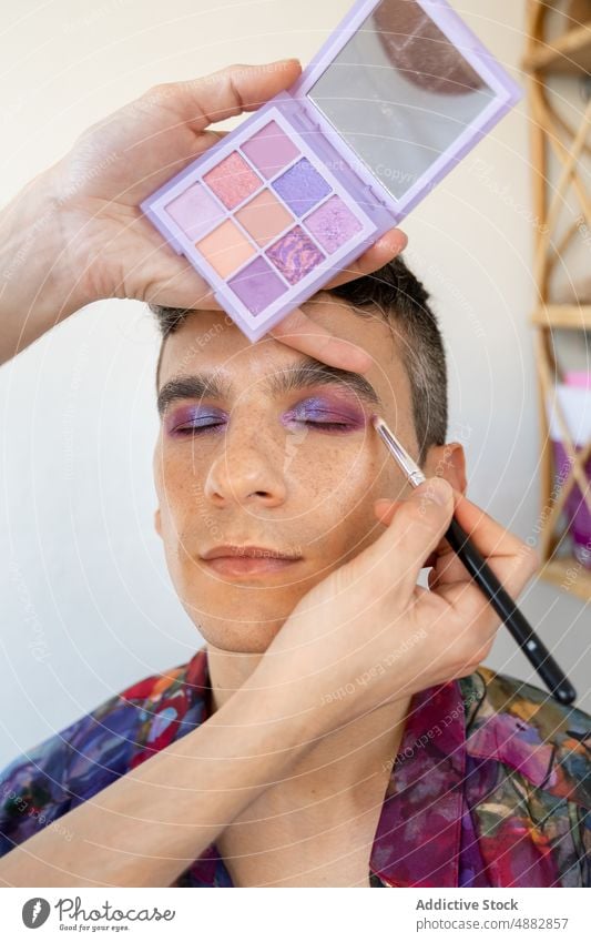 Transgender Man Getting Makeup Done By Boyfriend Couple Applying Eye Shadow Artist Cosmetic Gay Vanity Brush Together Palette Beautician Looking Away Beauty