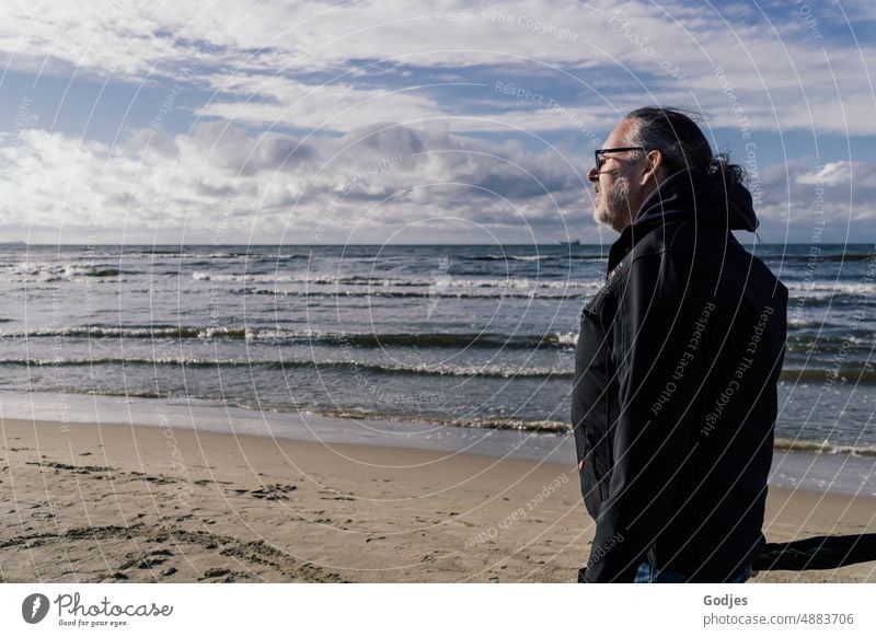 Older man in windbreaker walking along beach Man Beach Vacation & Travel Ocean Sand Water Human being Sun Sky Summer Loneliness coast Waves Clouds Horizon