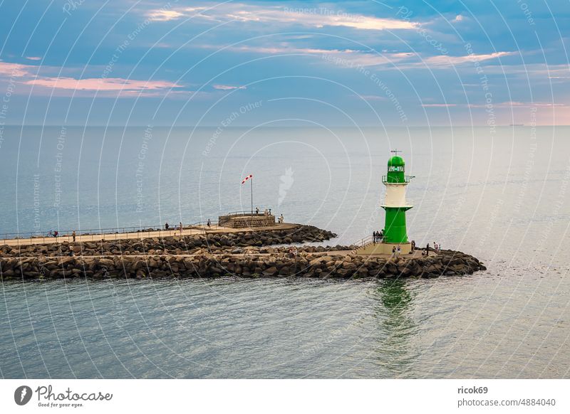 Pier on the Baltic coast in Warnemünde in the evening Baltic Sea Mole Ocean Warnemuende Rostock Lighthouse pier light Mecklenburg-Western Pomerania Landmark