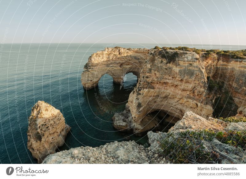 Beautiful Praia de la Marina in the Algarve in Portugal algarve atlantic atlantic ocean beach beautiful blue calcareous rock carved shoreline chapel coastline