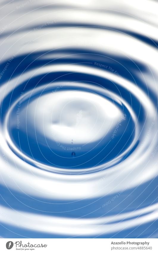 Macro image of water surface. Close up water background. droplet whirlpool hole macro stream minimalism purity concept underwater blue monochrome flow fresh