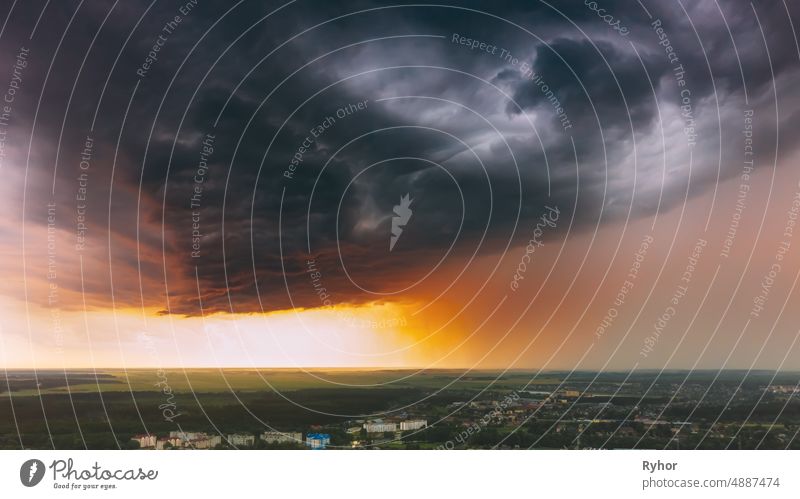 Stormy Sunset Sky Before Rain Above Skyline. Dramatic Cloudy Sky And Flash Light beautiful cloud cloudscape cloudy color dramatic sky environment europe