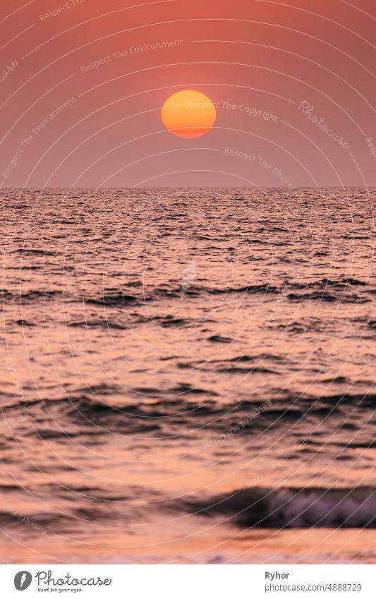 Natural Color Sunset Sunrise Sky Over Sea. Seascape With Shining Setting Sun On Sea Horizon beautiful big bright calm clear color copy space gently horizon hot