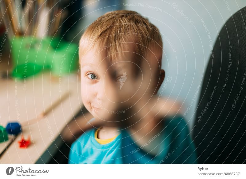 Little Blond Boy Shows His Hand Stained With Paint Smeared art authentic beautiful blot boy child childhood creation creative draw hand happiness happy