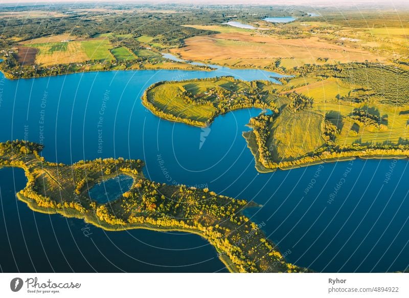 Lyepyel District, Lepel Lake, Beloozerny District, Vitebsk Region. Aerial View Of Residential Area With Houses In Countryside. Top View Of European Nature From High Attitude In Autumn. Bird's Eye View Of Lepel Lake In Sunny Evening