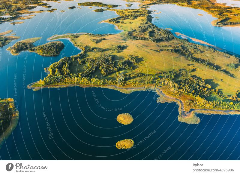 Braslaw Or Braslau, Vitebsk Voblast, Belarus. Aerial View Of Nedrava Lake And Green Forest Landscape In Sunny Autumn Morning. Top View Of Beautiful European Nature From High Attitude. Bird's Eye View. Famous Lakes. Natural Landmarks. Small Islands