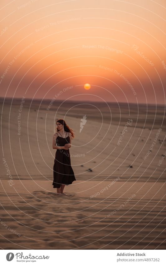 Female tourist walking in desert woman sand morning explore sky weekend doha qatar travel summer stroll vacation dawn dress relax tourism shore coast nature