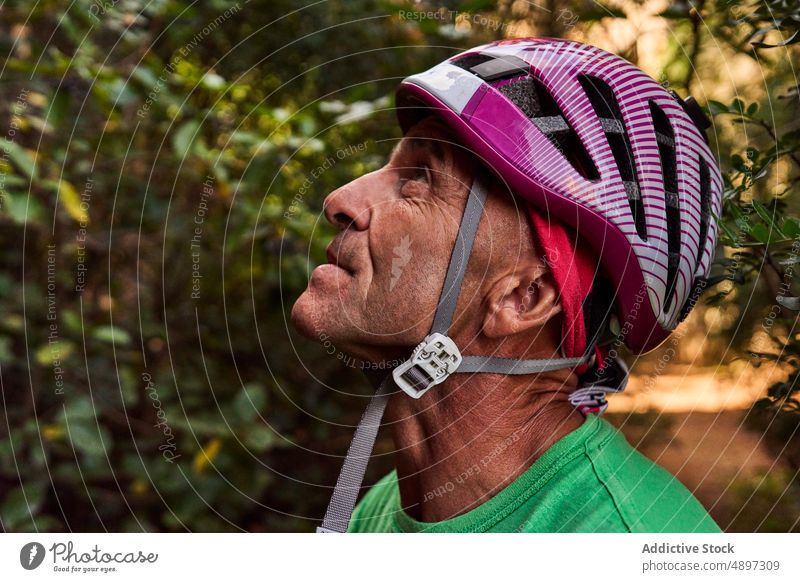 Senior Male Climber Wearing Helmet Active Looking Down Closeup Hiker Adventure Retirement Hiking Headscarf Fitness Cliff Aged Sport Athlete Activity Vacation